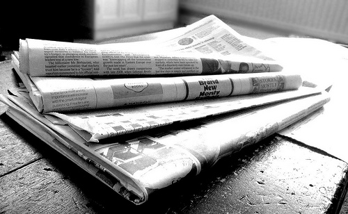 black and white picture of newspapers