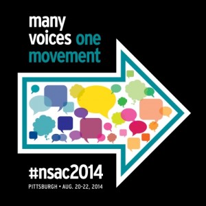 nsac logo: on black background it says "many voices" in white and "one movement" in teal.  There is a large arrow filled with speech bubbles pointing to the right.